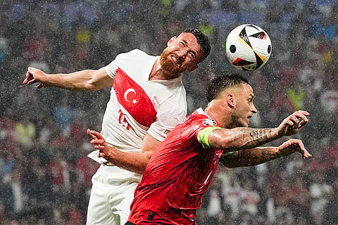 Salih Ozcan and Marko Arnautovic head the ball